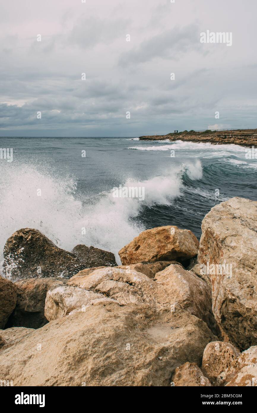 splashes of water from mediterranean sea near rocks Stock Photo Alamy