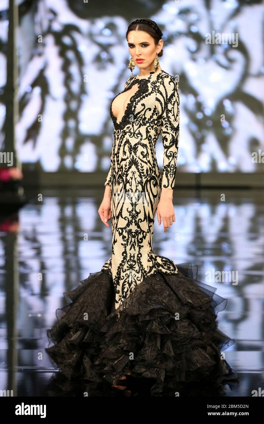 SEVILLA, SPAIN - JAN 31: model XXX wears the Model wearing a dress from the  Madamme collection by designer F de Frank as part of the SIMOF 2020 (Photo  credit: Mickael Chavet