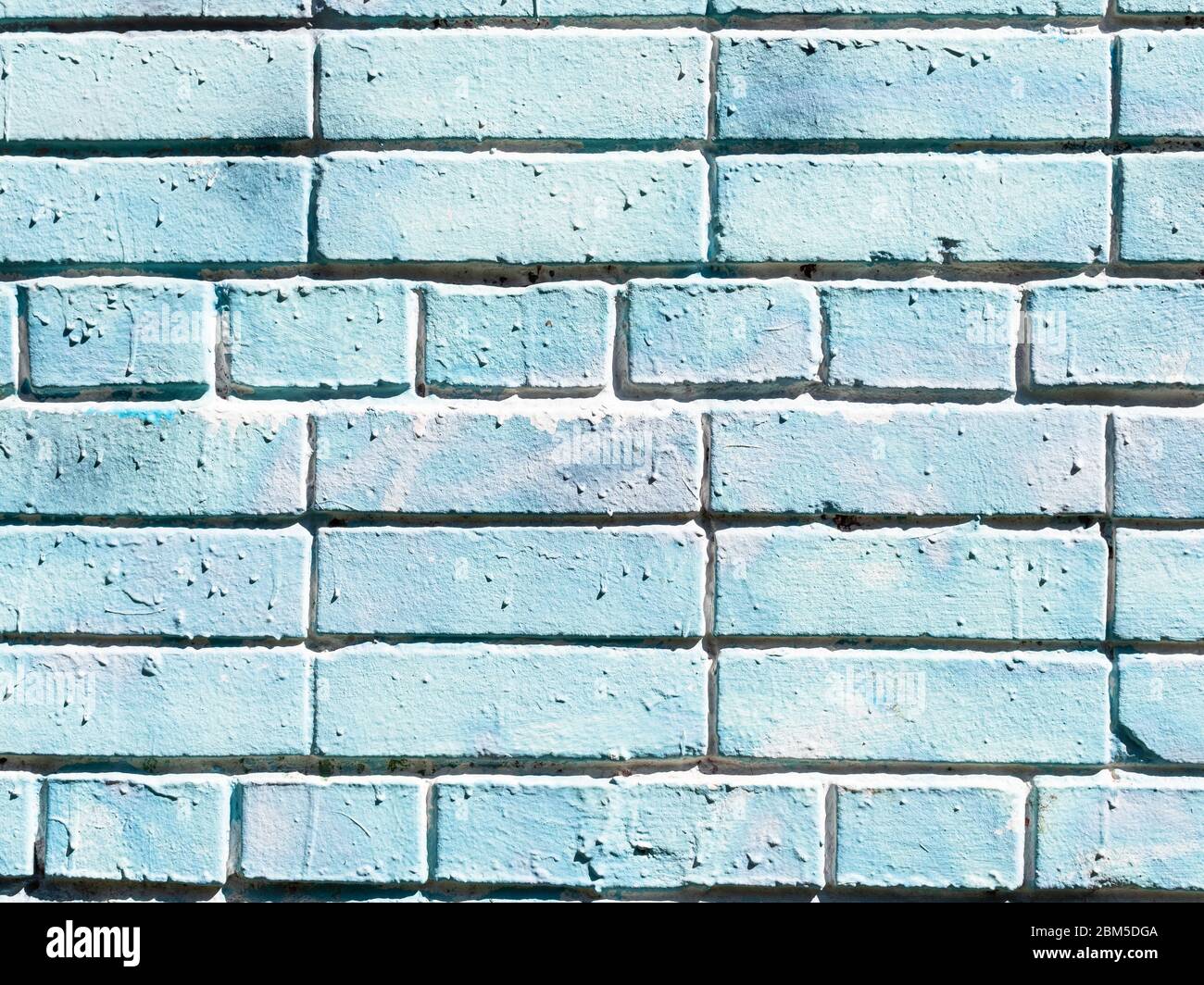 construction background - outdoor wall of house from blue painted bricks Stock Photo
