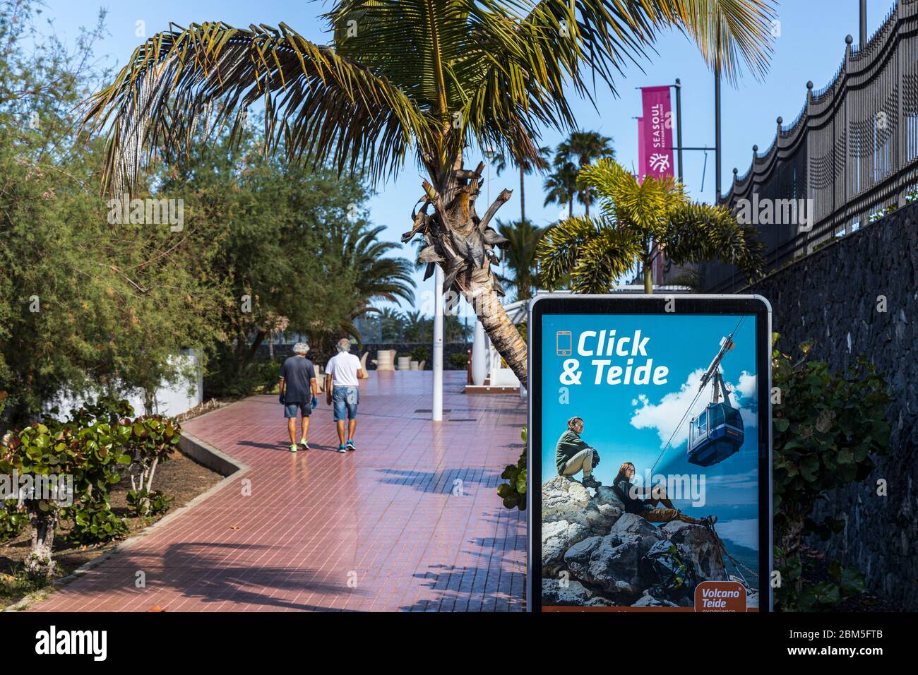 Poster advertising trips on the cable car to the top of Teide volcano on the promenade in Playa fanabe during the Covid 19 State of Emergency in Costa Stock Photo