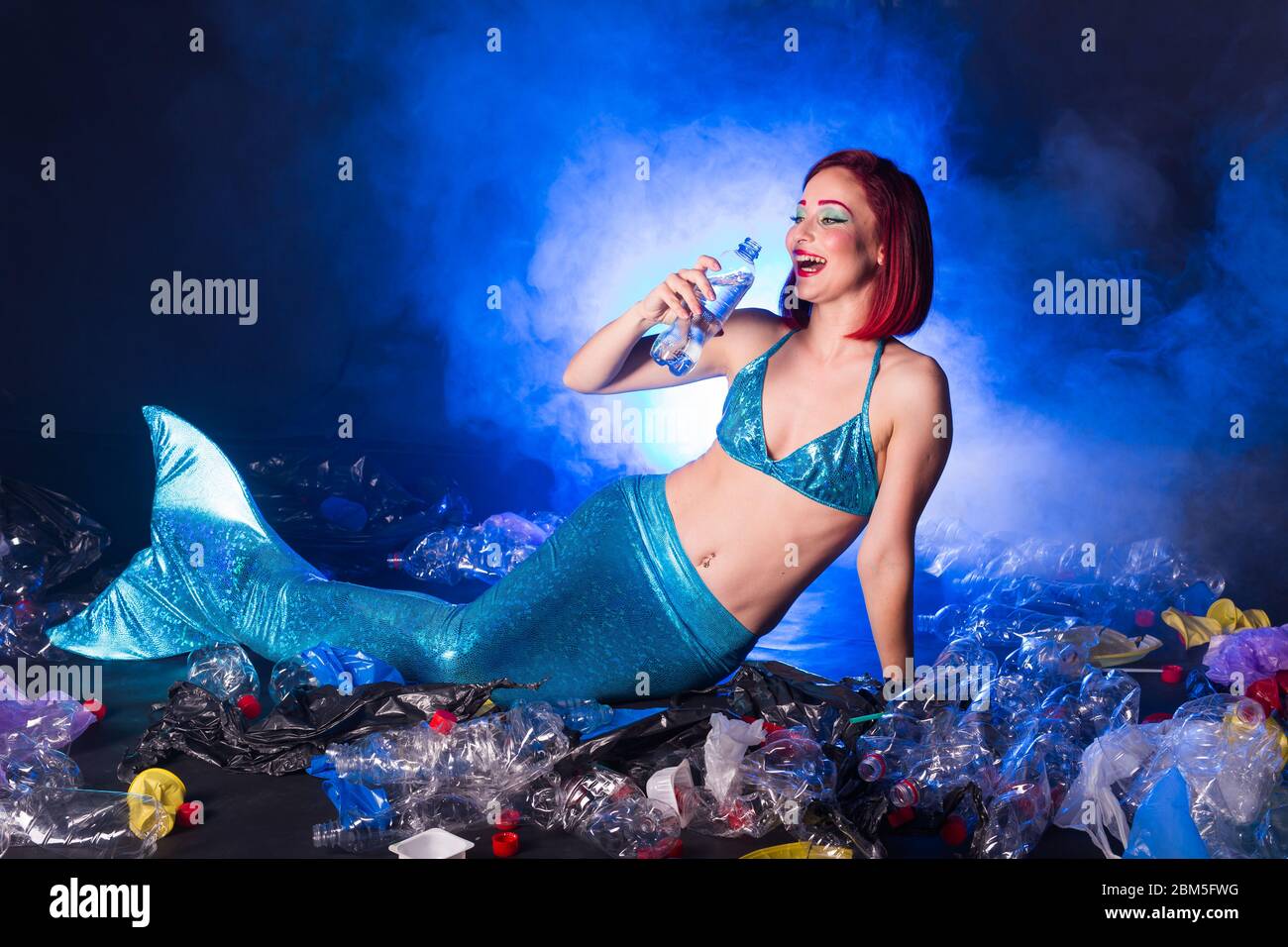 https://c8.alamy.com/comp/2BM5FWG/ocean-pollution-rubbish-in-the-water-stupid-fairytale-mermaid-in-dirty-ocean-plastic-trash-and-garbage-in-water-environmental-problem-plastic-bag-2BM5FWG.jpg