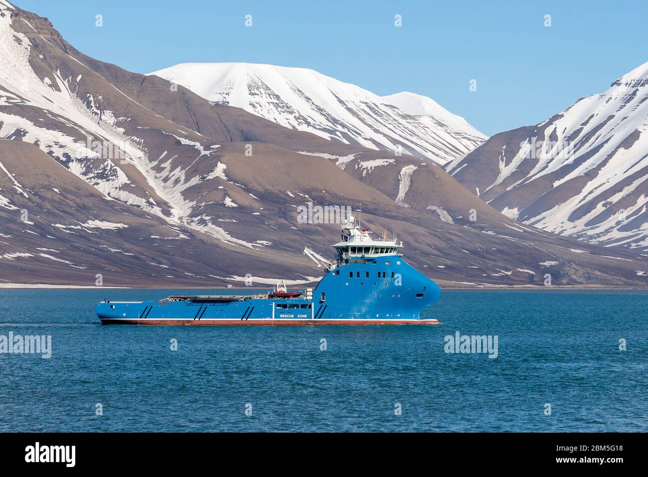 Offshore supply vessel at anchor on Longyearbyen, Svalbard. AHTS. Stock Photo
