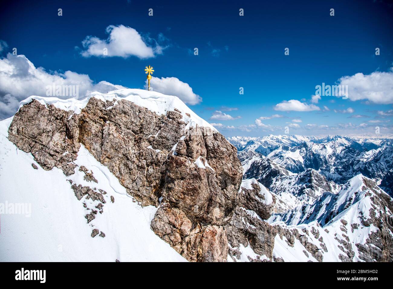 Cross on the Zugspitze mountain Stock Photo
