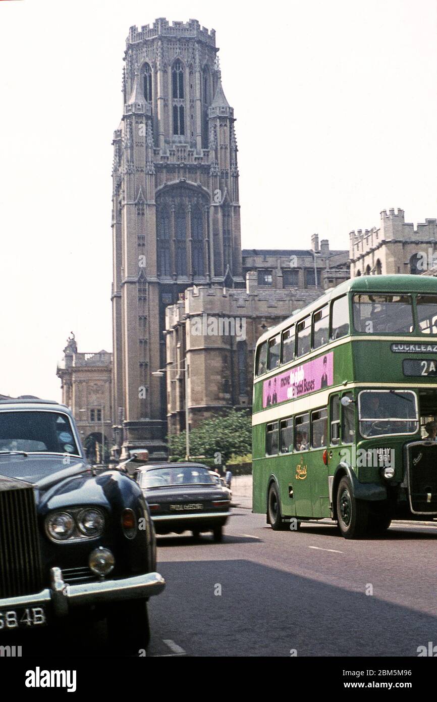 Bristol in the 60s and 70s:  Bristol University’s Wills Memorial Building in June 1970 with the city’s Museum and Art Gallery in the background.  In the foreground heading along Park Row is a Bristol Omnibus KSW type bus, which was standard for the city’s bus company during the 1950s and 60s but would have been reaching the end of its working life in the early 70s.  It entered service in 1955 and had a 6-cylinder Bristol diesel engine with four speed manual gearbox, giving a top speed of 31 m.p.h.  There were 60 seats.  This one was on the 2A route from Shirehampton to Lockleaze and would have Stock Photo