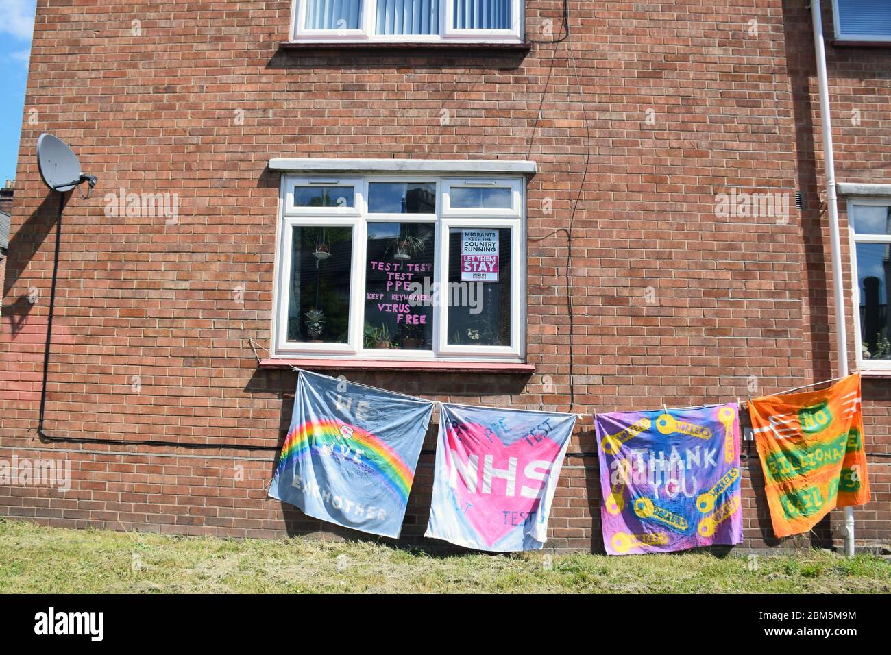 Supportive banners (including pro migrants) outside property in Norwich during Coronavirus lockdown, UK May 2020 Stock Photo