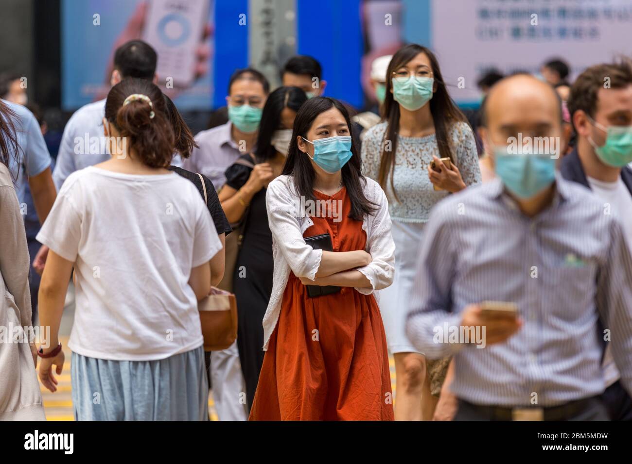 Hong Kong, Hong Kong. 7 May, 2020 Hongkongers wear surgical masks on the streets, amid the coronavirus pandemic. Today is the last day before the HK Government lifts some of the public restrictions. Hong Kong has now had a run of no locally transmitted infections for 18 days. Credit: David Ogg/Alamy Live News Stock Photo