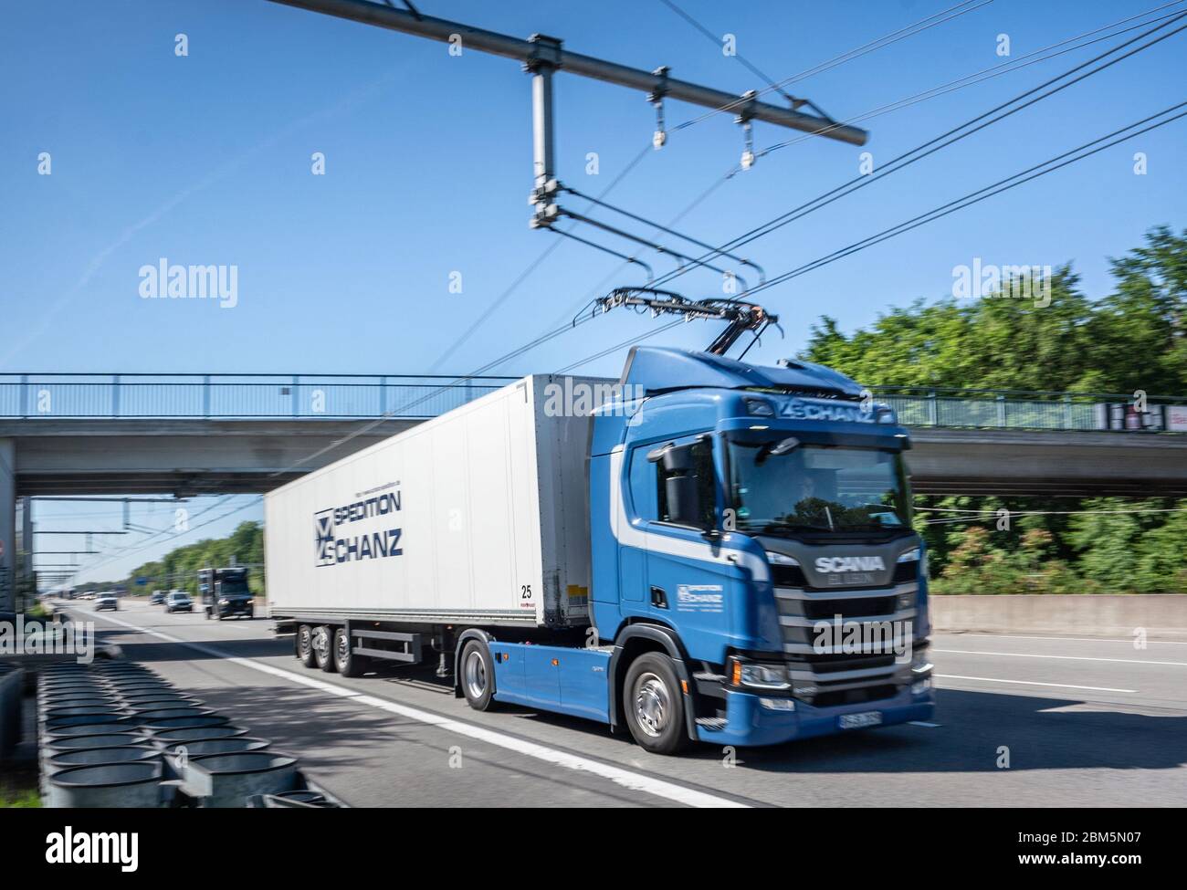 Erzhausen, Germany. 07th May, 2020. A Scania R450 hybrid tractor unit  drives with the pantograph extended on the first German test track for  electric trucks with overhead contact lines on the Autobahn
