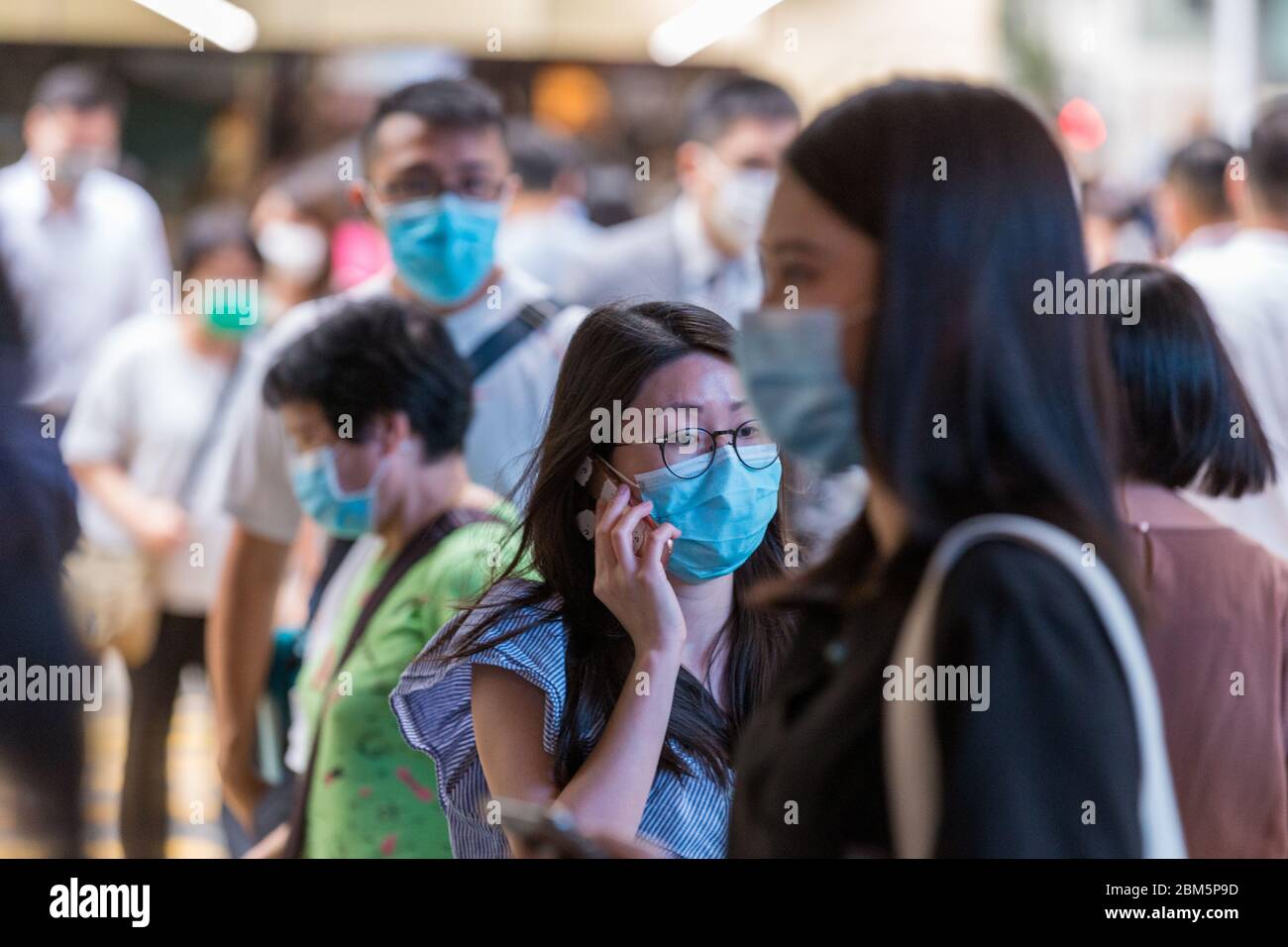 Hong Kong, Hong Kong. 7 May, 2020 Hongkongers wear surgical masks on the streets, amid the coronavirus pandemic. Today is the last day before the HK Government lifts some of the public restrictions. Hong Kong has now had a run of no locally transmitted infections for 18 days. Credit: David Ogg/Alamy Live News Stock Photo