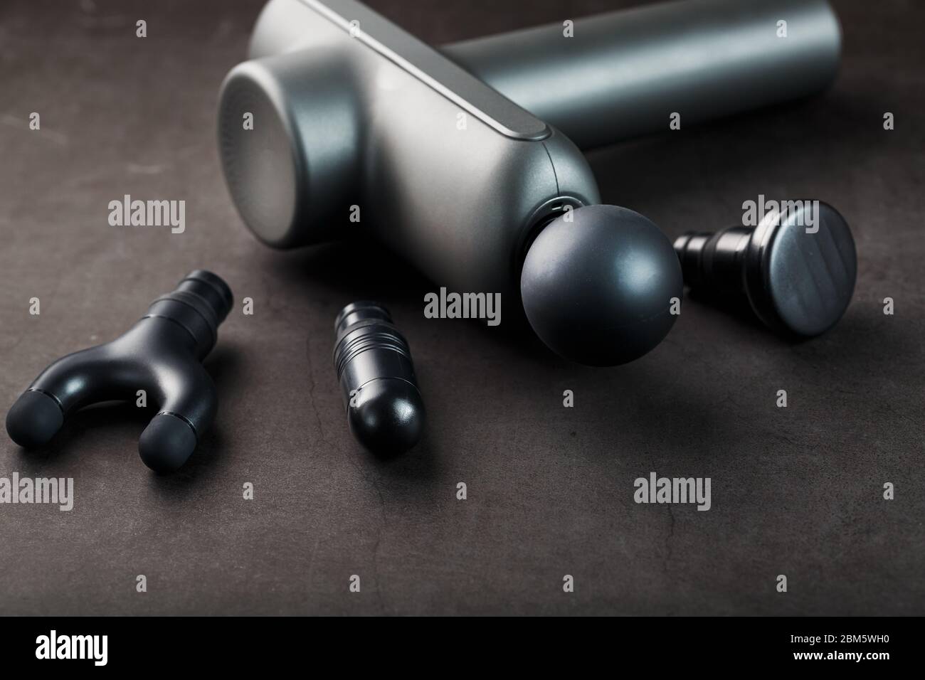 Machine for body massage on a black background. Universal device for  improving the whole body, works on vibration technology. Electric massager  Stock Photo - Alamy