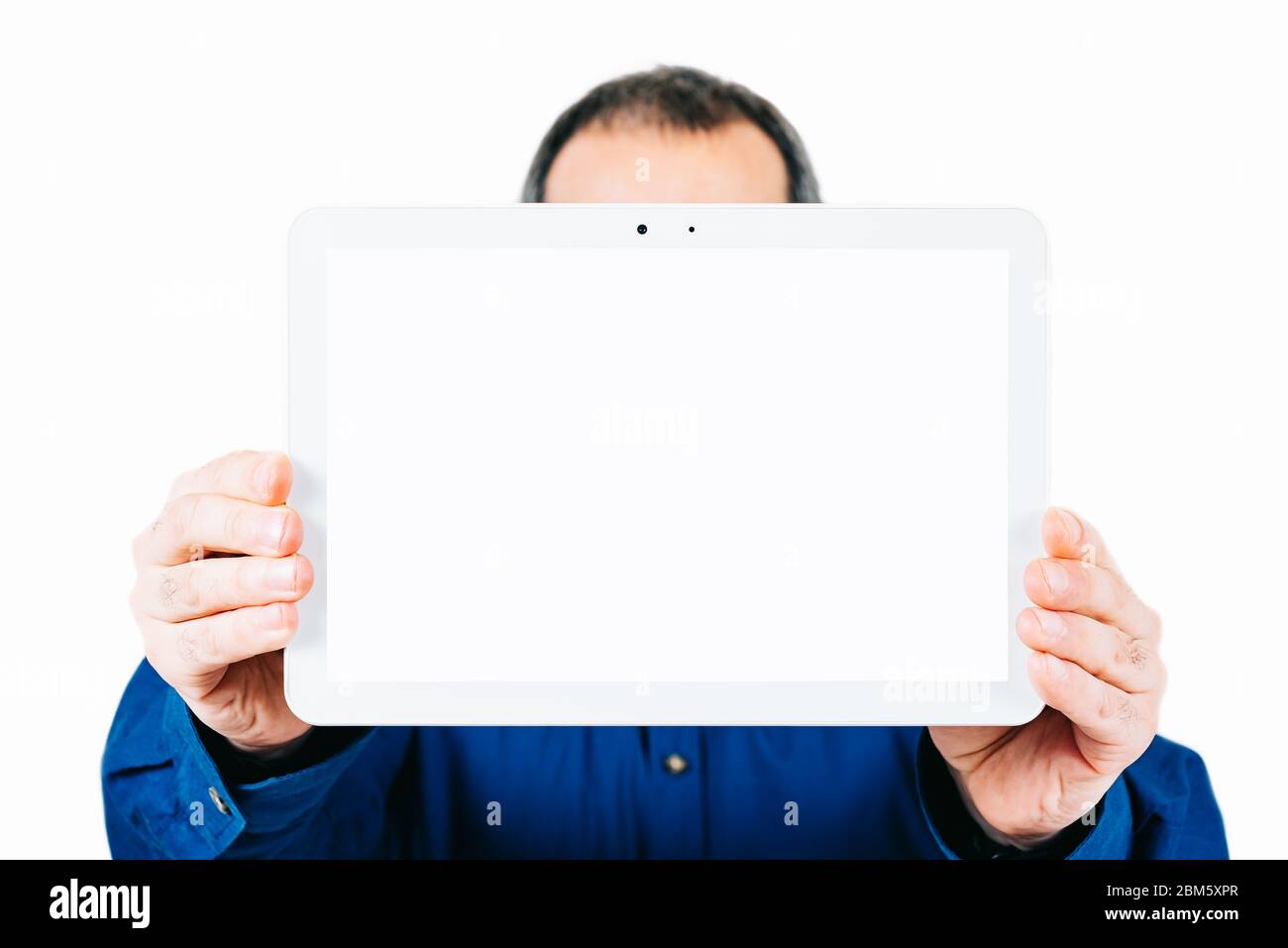 man holding a tablet with a blank screen Stock Photo