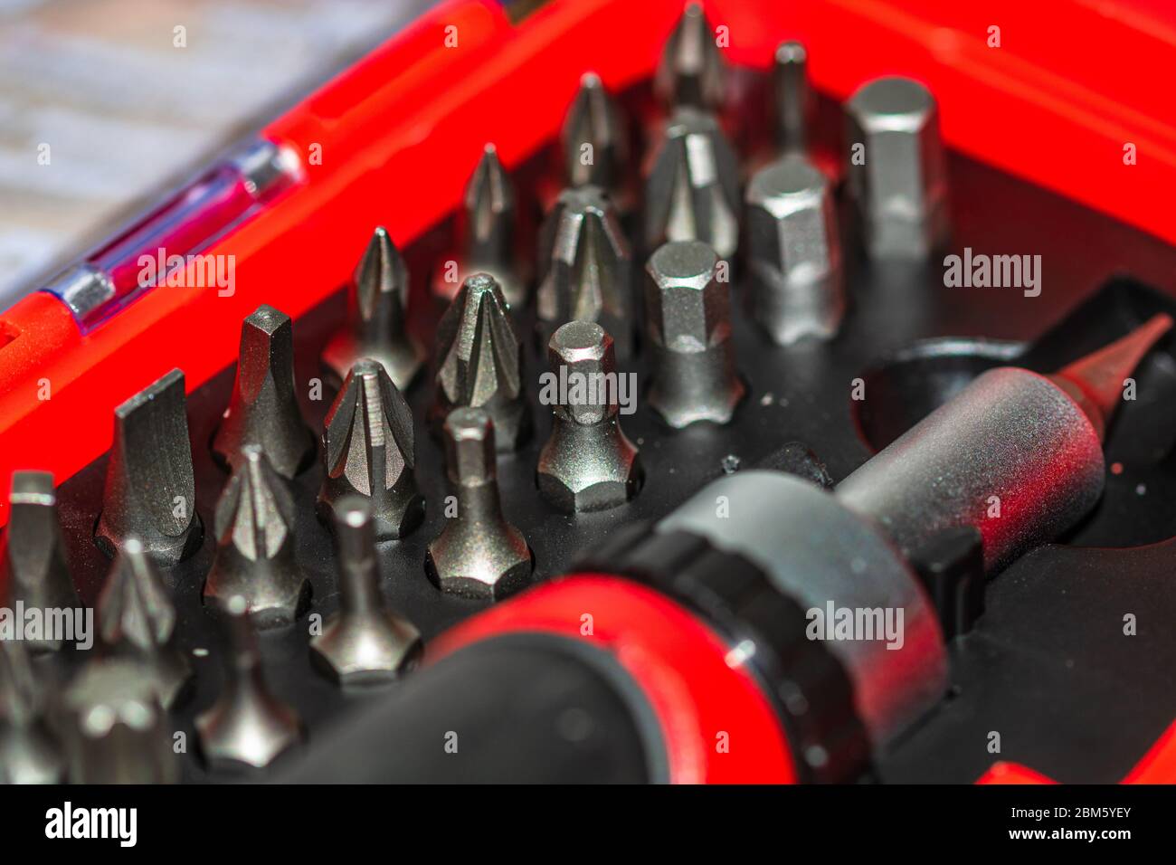 Close up of interchangeable screwdriver set with different types of