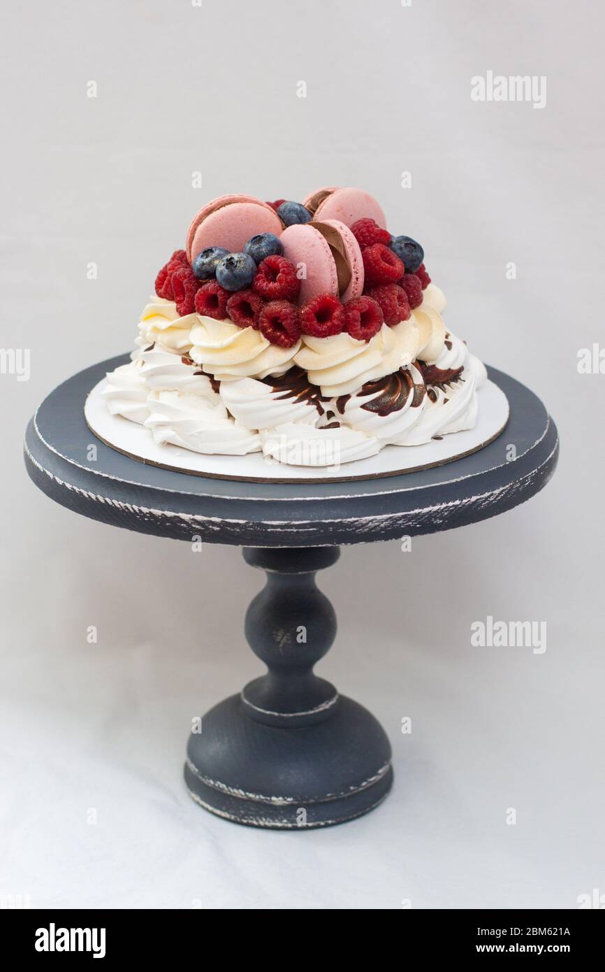 Meringue pavlova cake with whipped cream, fresh strawberries