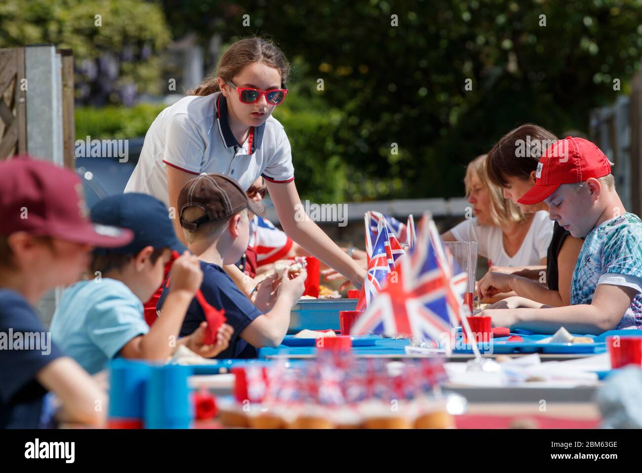 Children and staff at Breadsall Primary School in Derby during a VE Day lunch party to mark the 75th anniversary of the end of the Second World War in Europe. Stock Photo