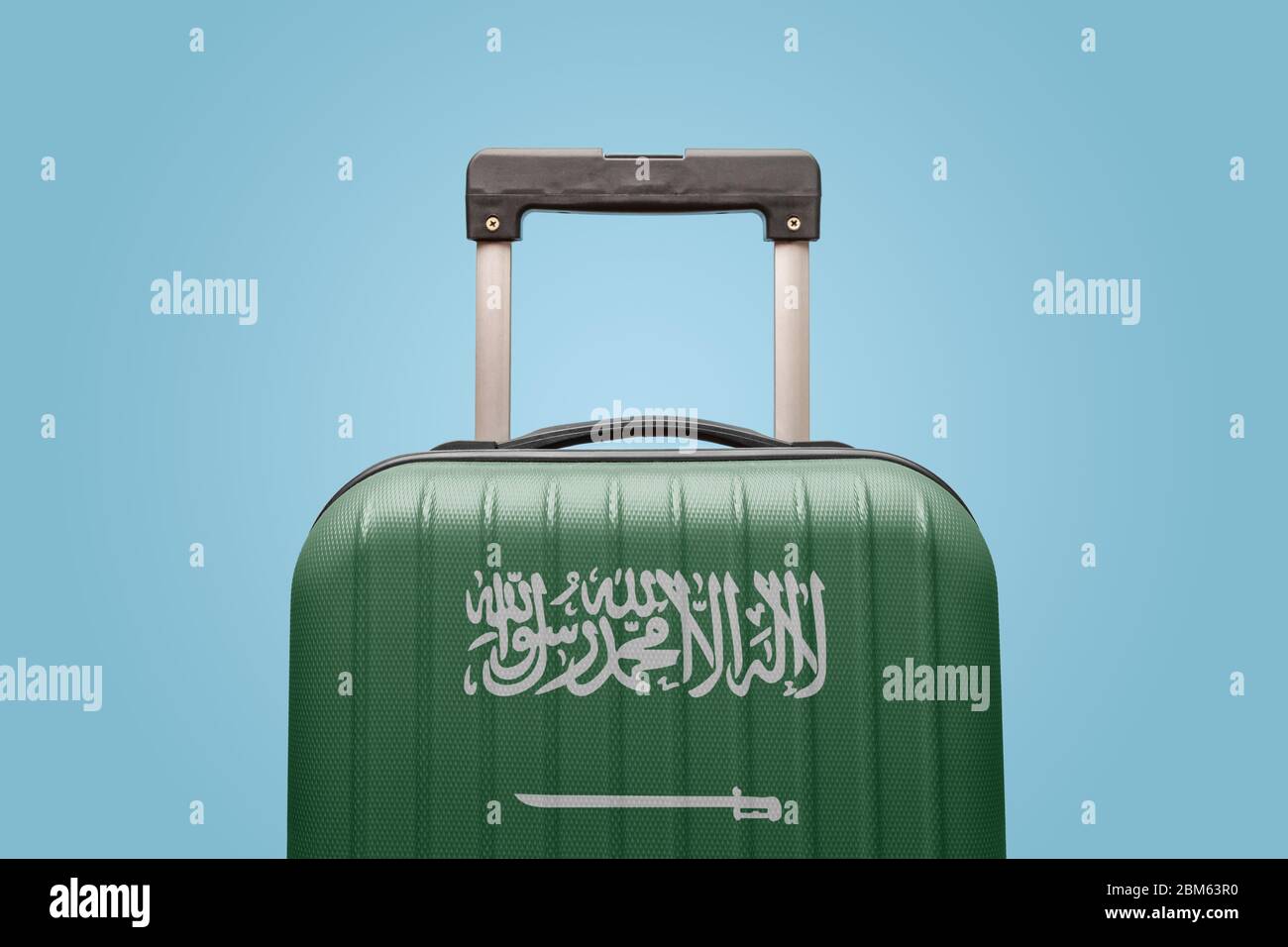 Suitcase with Saudi Arabian flag design travel Asia concept Stock Photo