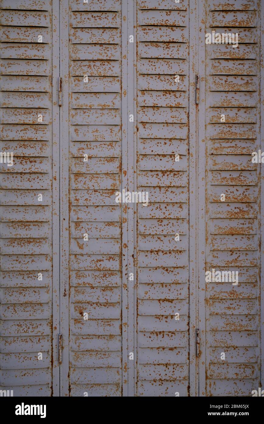 Old weathered real rusty steel door wallpaper metal background texture