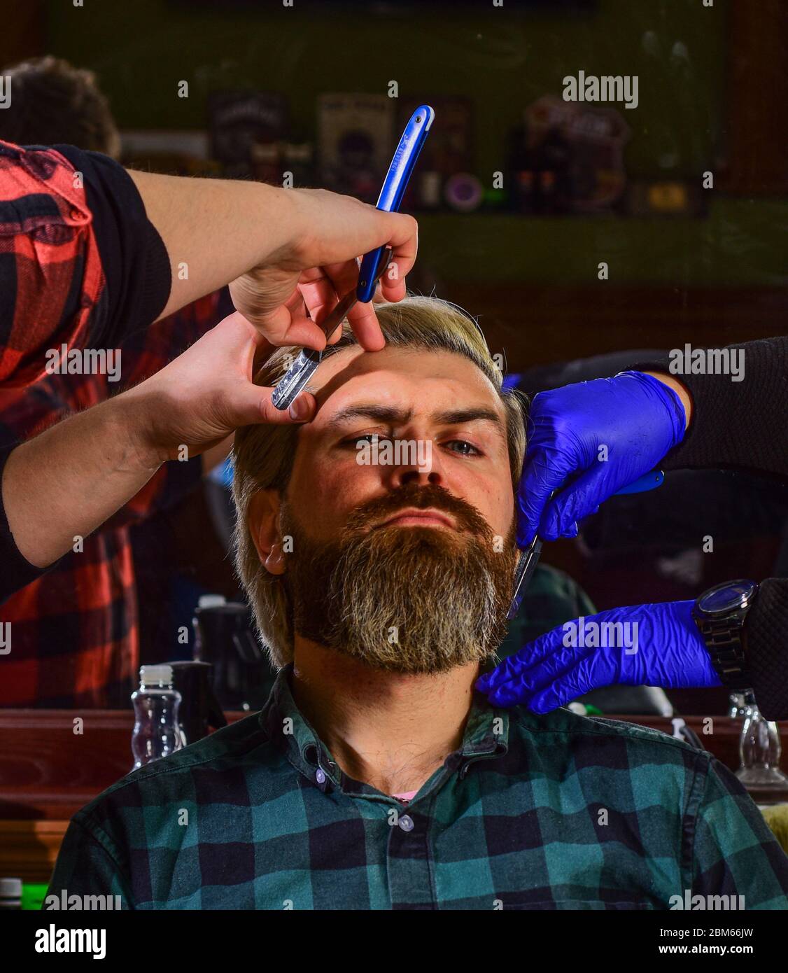 Man at hairdresser salon. Mastered craft from cutting hair every day