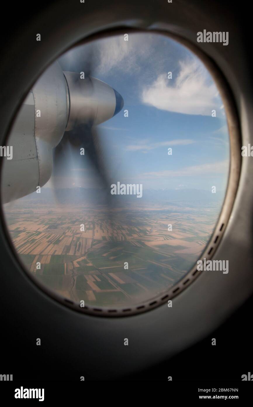 View from the plane's illuminator on a rotating propeller. Flying at