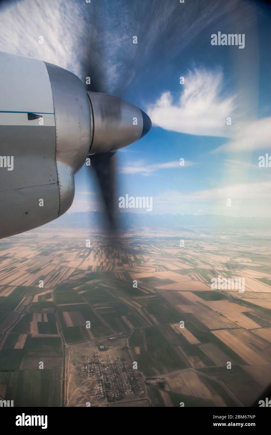 View from the plane's illuminator on a rotating propeller. Flying at
