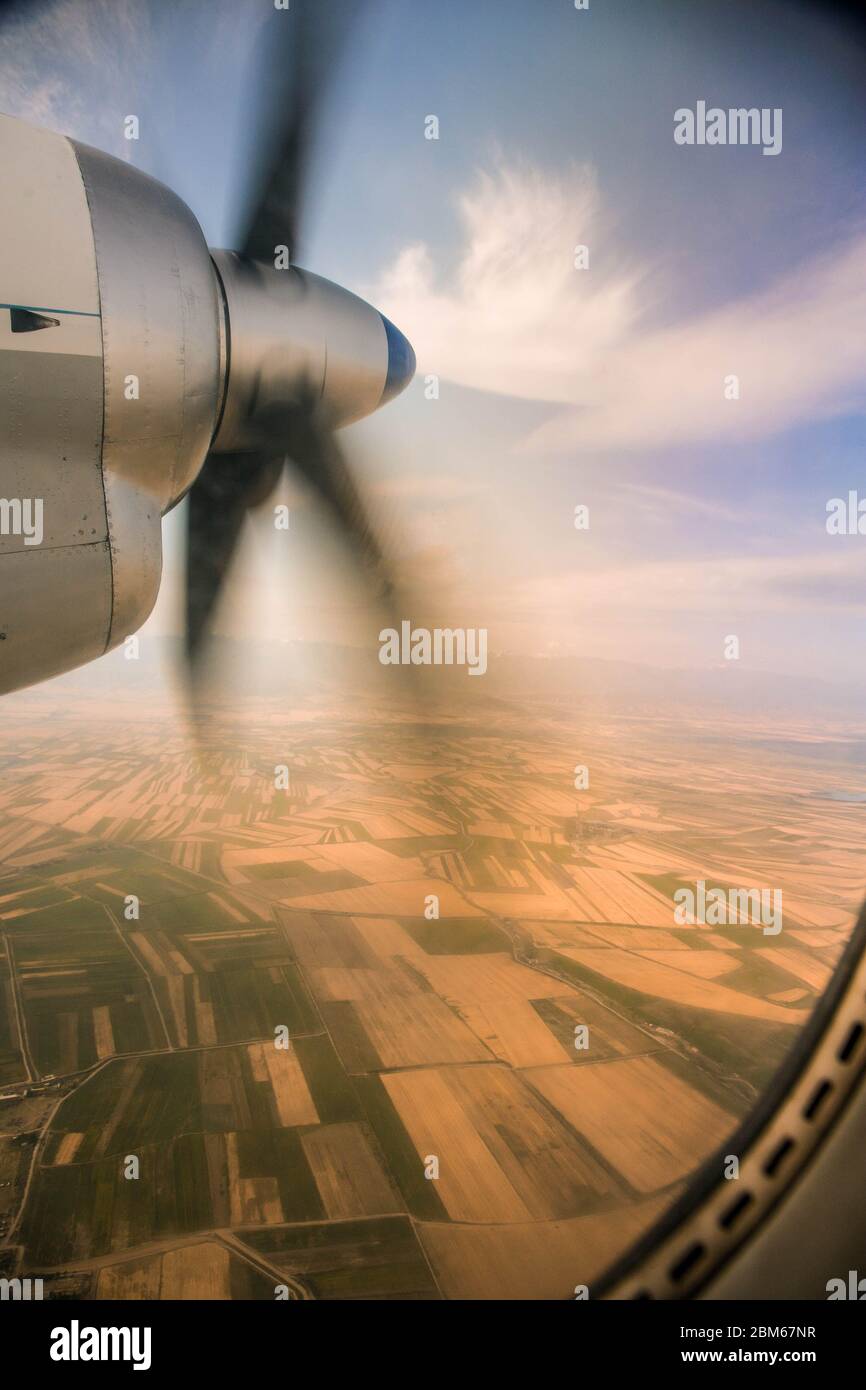 View from the plane's illuminator on a rotating propeller. Flying at