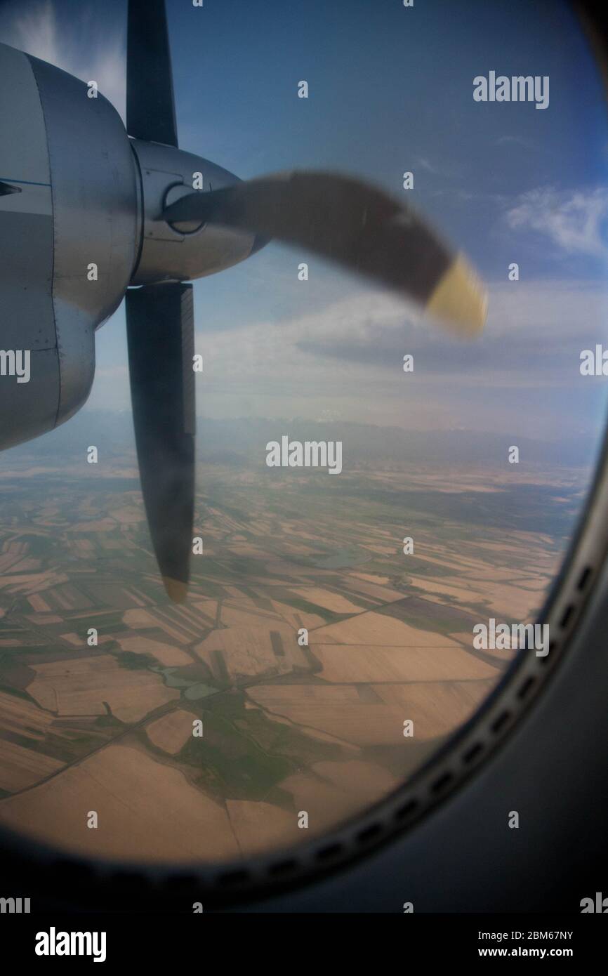 View from the plane's illuminator on a rotating propeller. Flying at