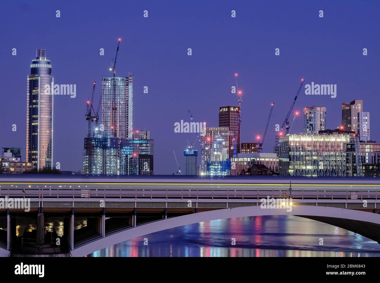 View of city buildings at Vauxhall as seen from Chelsea Bridge during Blue Hour Stock Photo