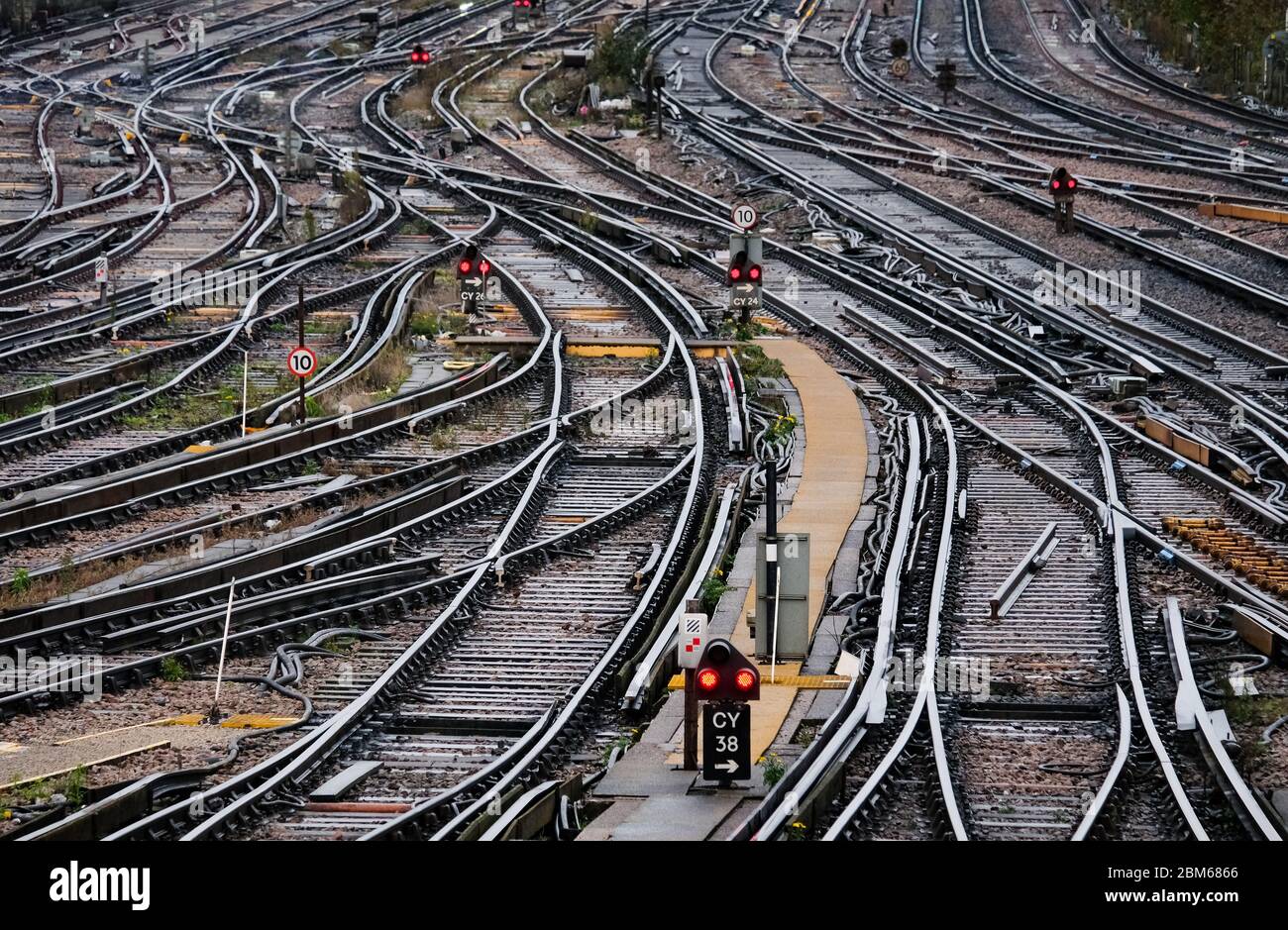 Multiple railway tracks leading into a London railway station. Stock Photo