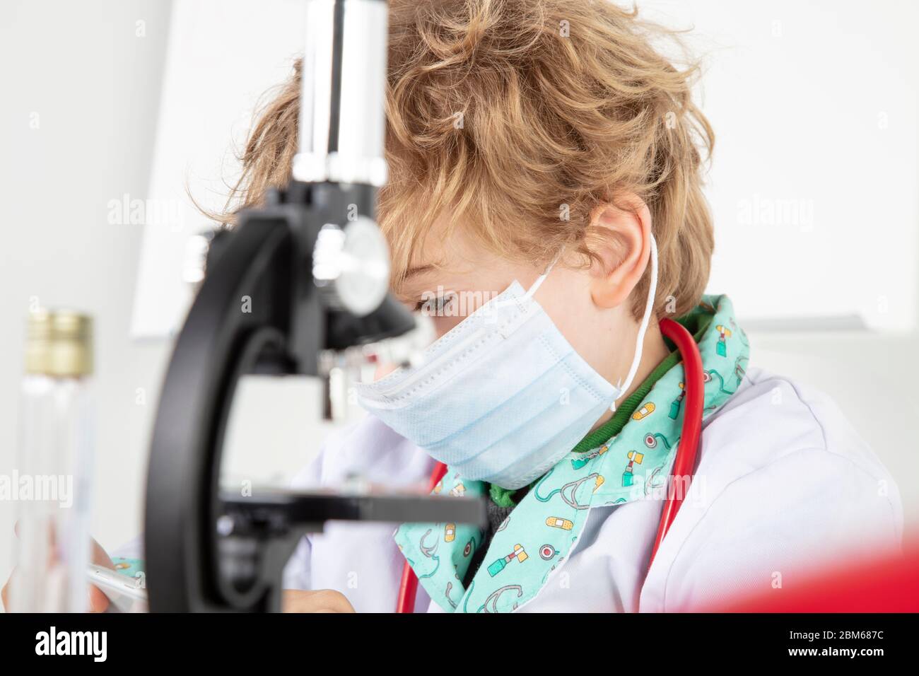 focused young doctor working in a protective mask Stock Photo