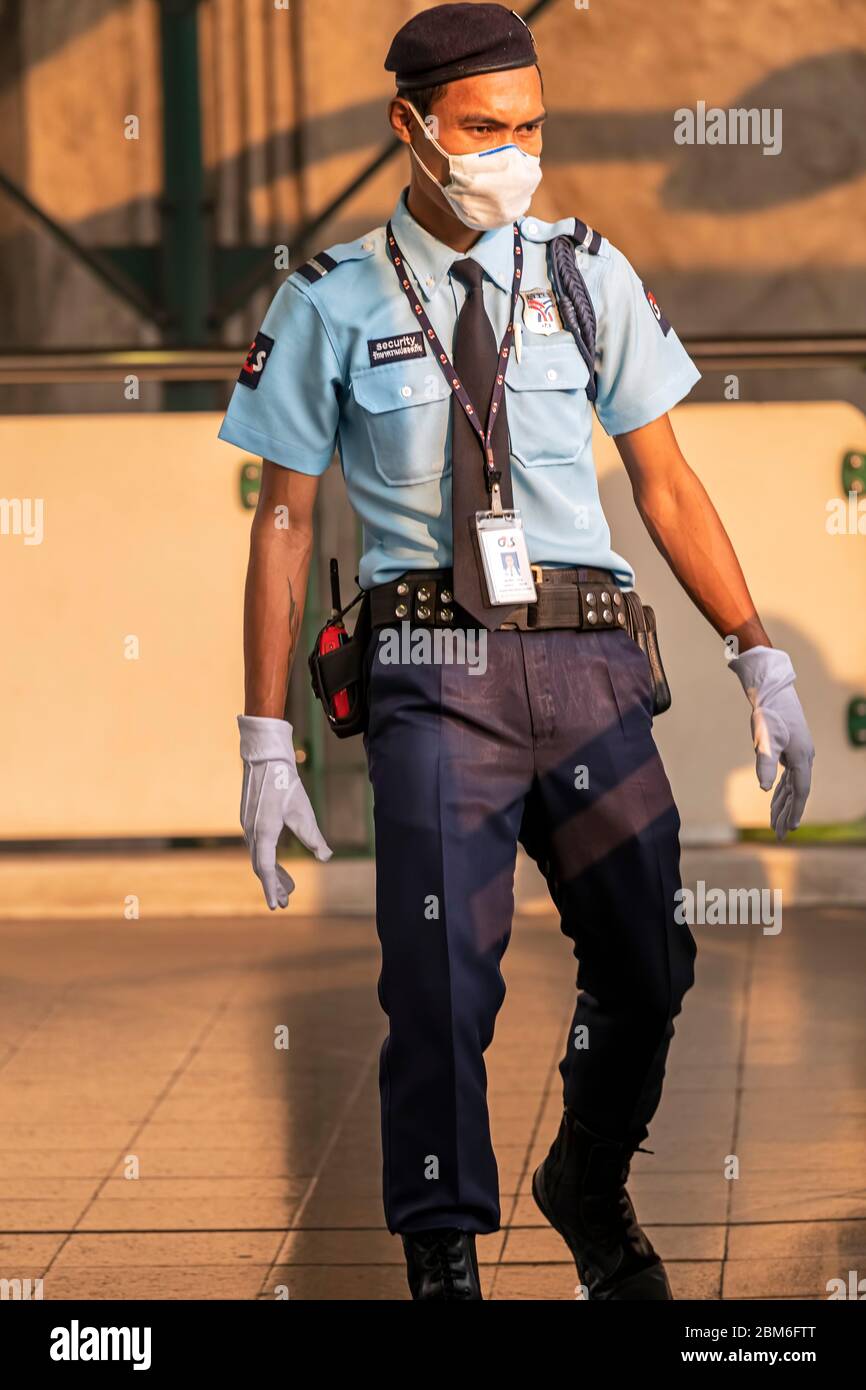 Security guard with face mask and gloves during Covid 19 pandemic