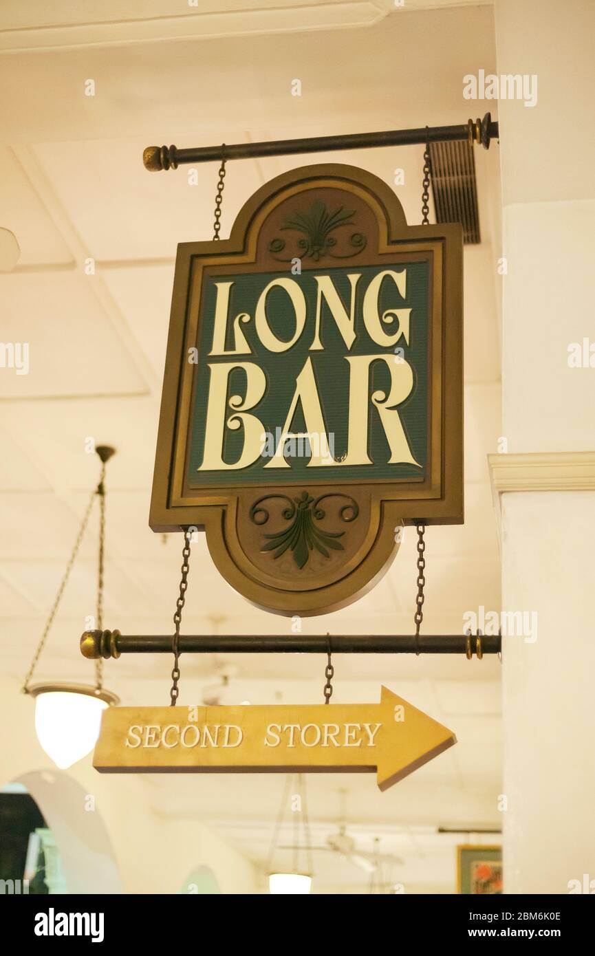 Raffles Hotel Long Bar Sign at night, Singapore Stock Photo
