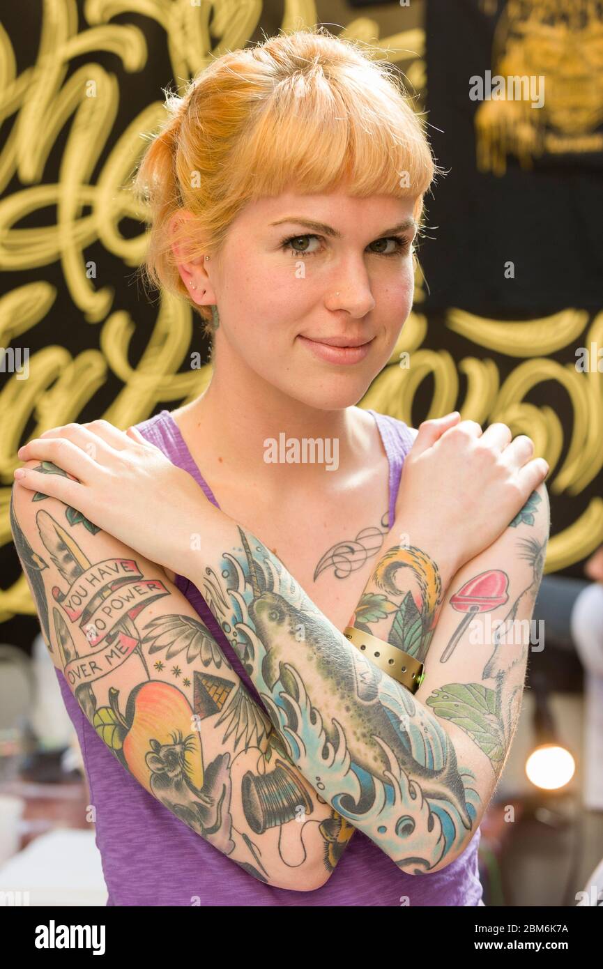 Tattooed woman at The London Tattoo Convention, Tobacco Dock, 50 Porters  Walk, London, UK. 25 Sep 2009 Stock Photo