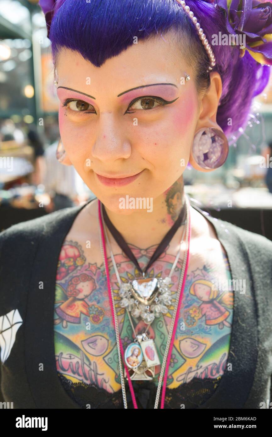 Tattooed woman at The London Tattoo Convention, Tobacco Dock, 50 Porters Walk, London, UK.  25 Sep 2009 Stock Photo
