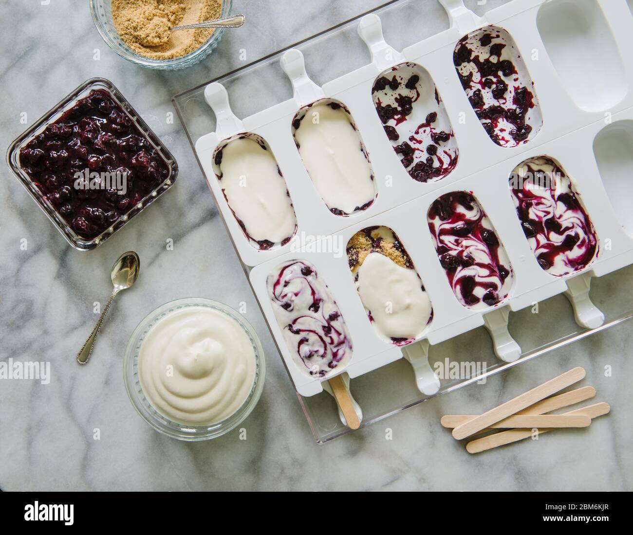 Popsicles with blueberry jam, cream cheese and graham cracker crumbs Stock Photo Alamy