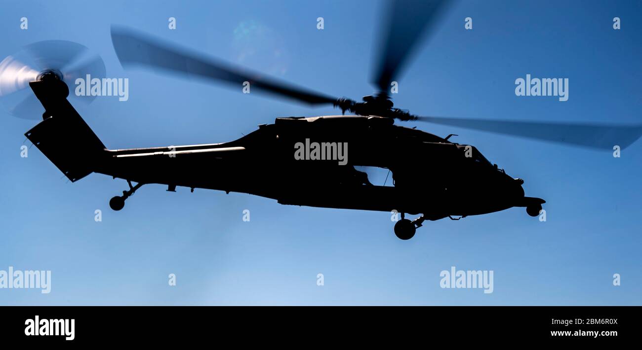 ATLANTIC OCEAN (May 5, 2020) An MH-60S Sea Hawk helicopter assigned to the 'Sea Knights' of Helicopter Sea Combat Squadron (HSC) 22 takes off from the flight deck of the Freedom-class littoral combat ship USS Detroit (LCS 7). Detroit is deployed to the U.S. Southern Command area of responsibility to support Joint Interagency Task Force South's mission, which includes counter illicit drug trafficking in the Caribbean and Eastern Pacific. (U.S. Navy photo by Mass Communication Specialist 2nd Class Anderson W. Branch/Released) Stock Photo