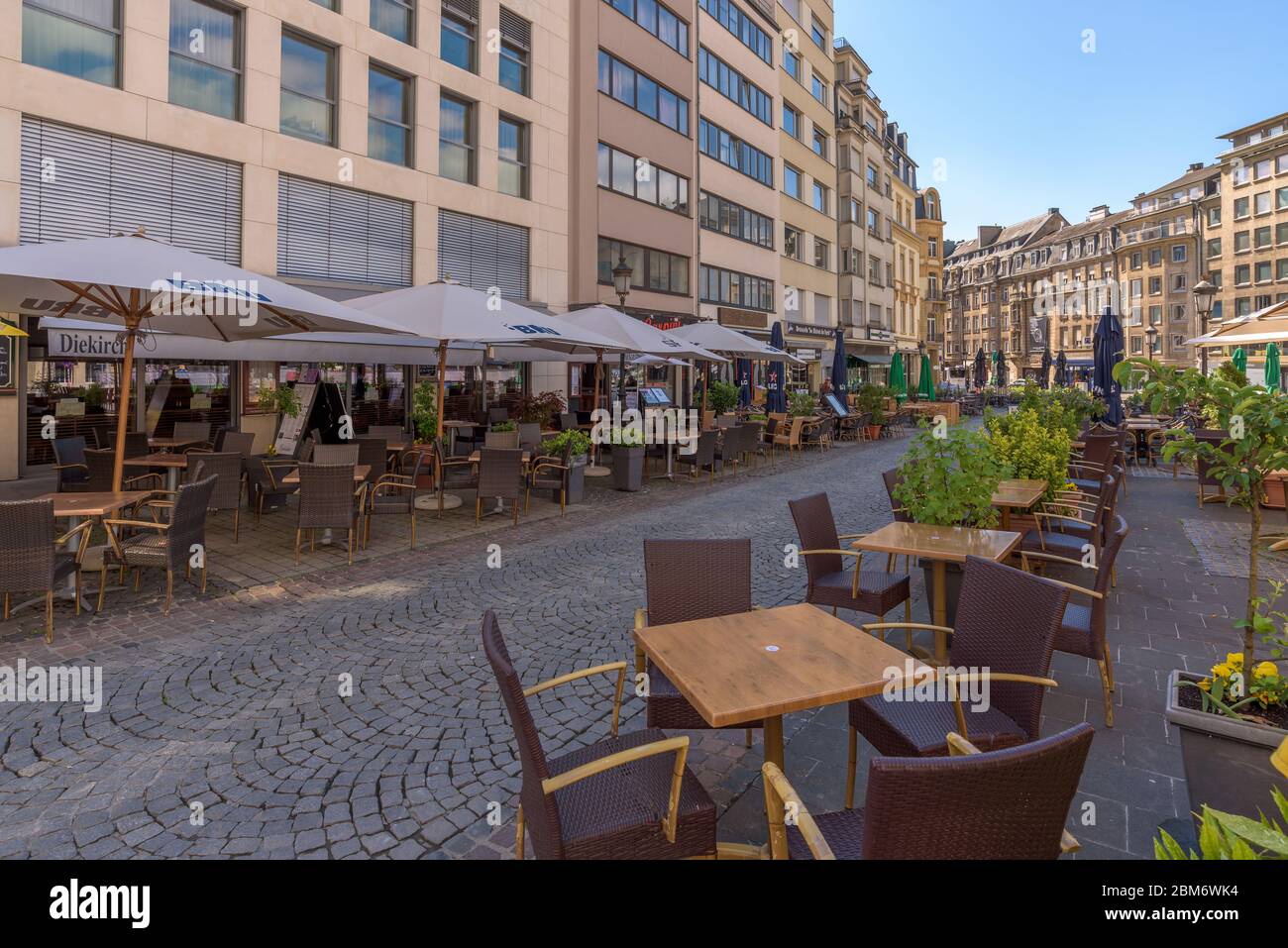 Luxembourg City. Empty alfresco chairs and tables of Cafes, brasseries and restaurants on Place de Paris in the Gare (Station) district of the capital. Stock Photo
