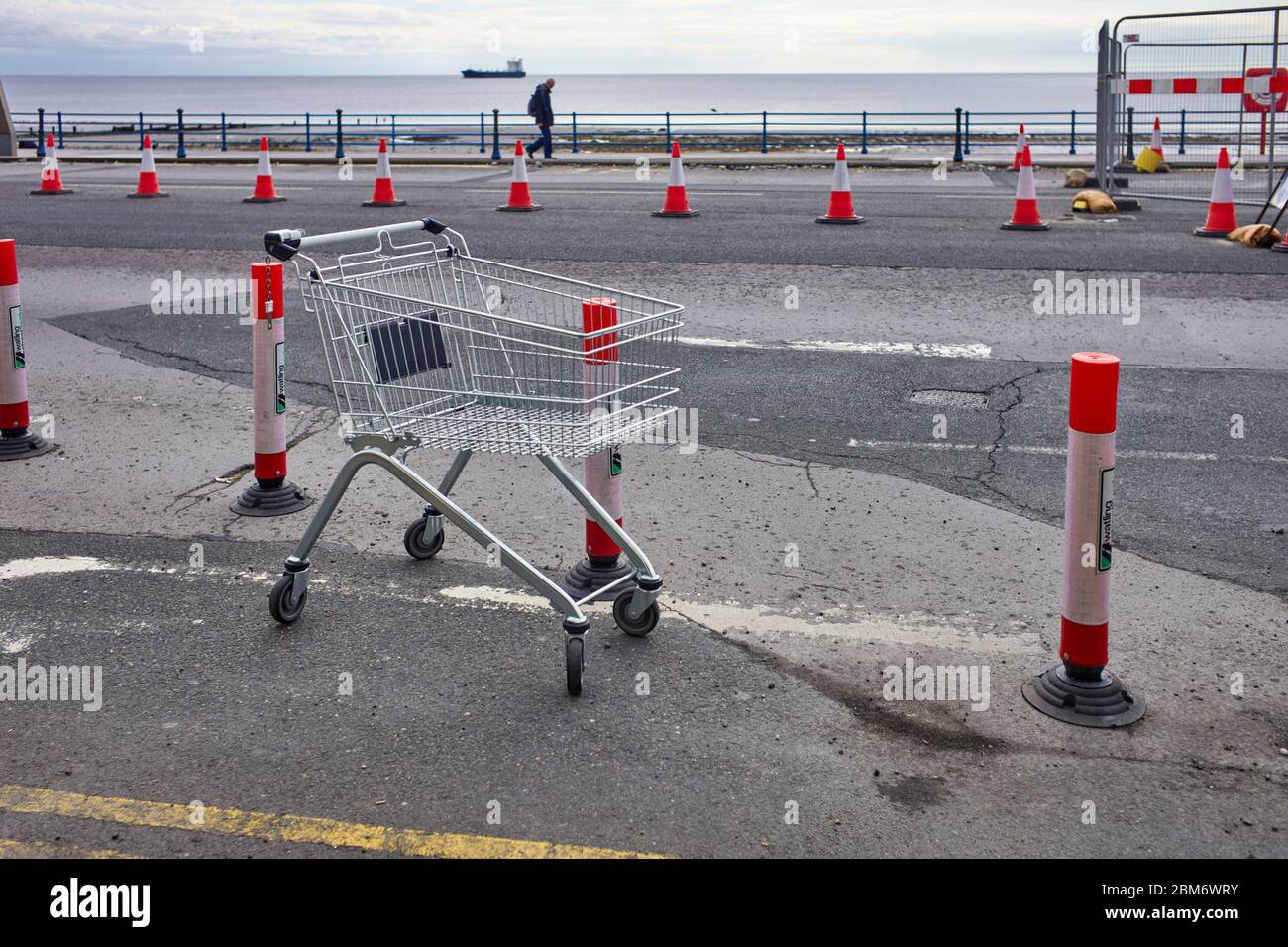Abandoned shopping trolley left on seafront at Douglas, Isle of Man Stock Photo