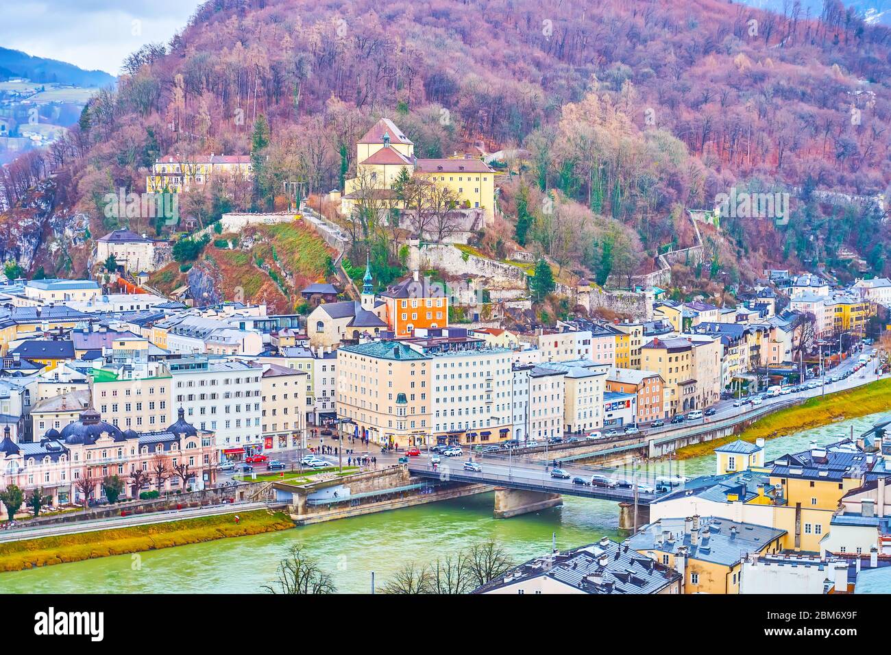 SALZBURG, AUSTRIA - MARCH 1, 2019: Enjoy great view from Monchsberg hill on medieval neighborhood with Capuchin monastery on Kapuzinerberg hill, on Ma Stock Photo