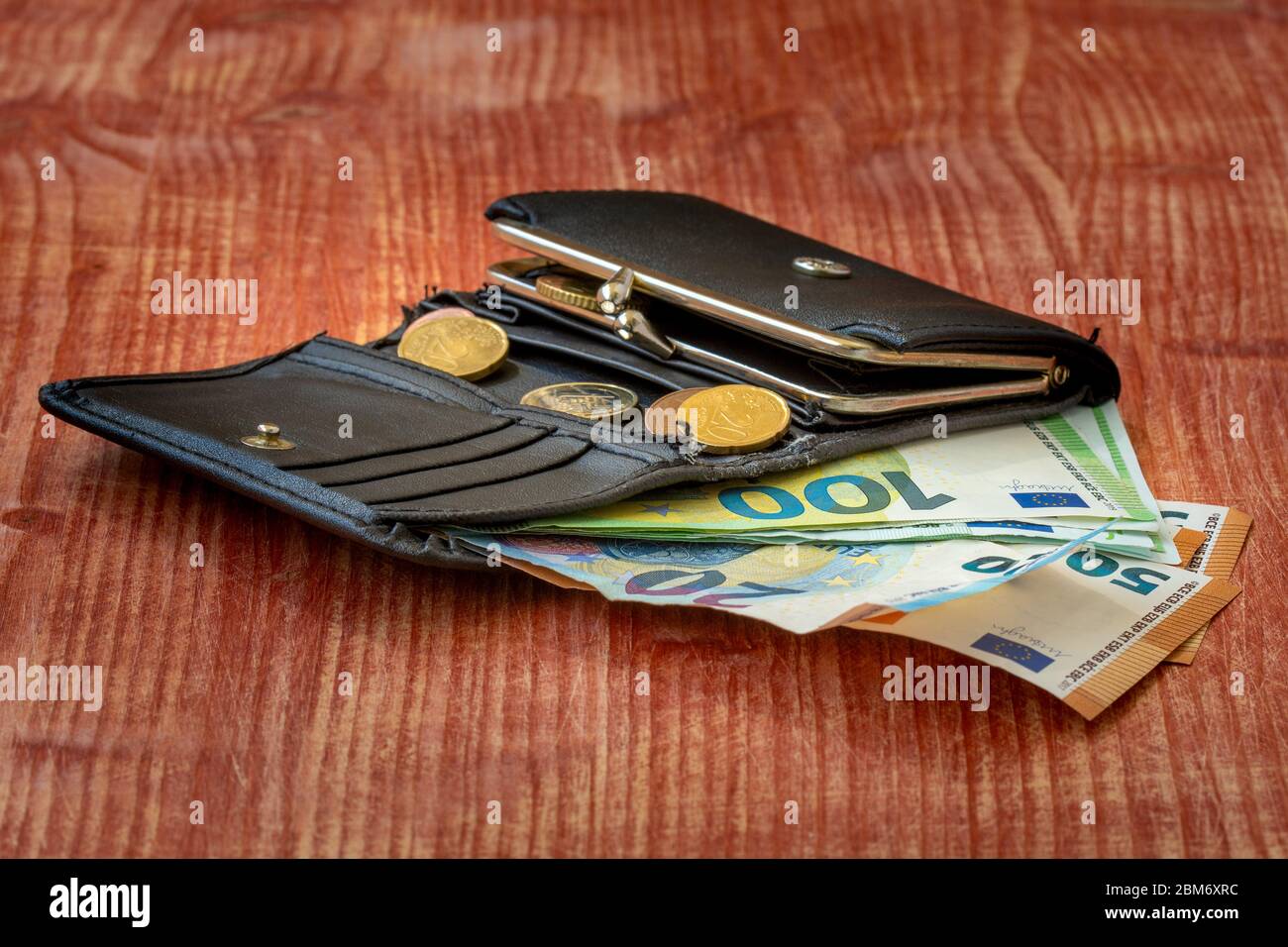 Wallet Inside Spending wallet inside money hi-res stock photography and images - Alamy