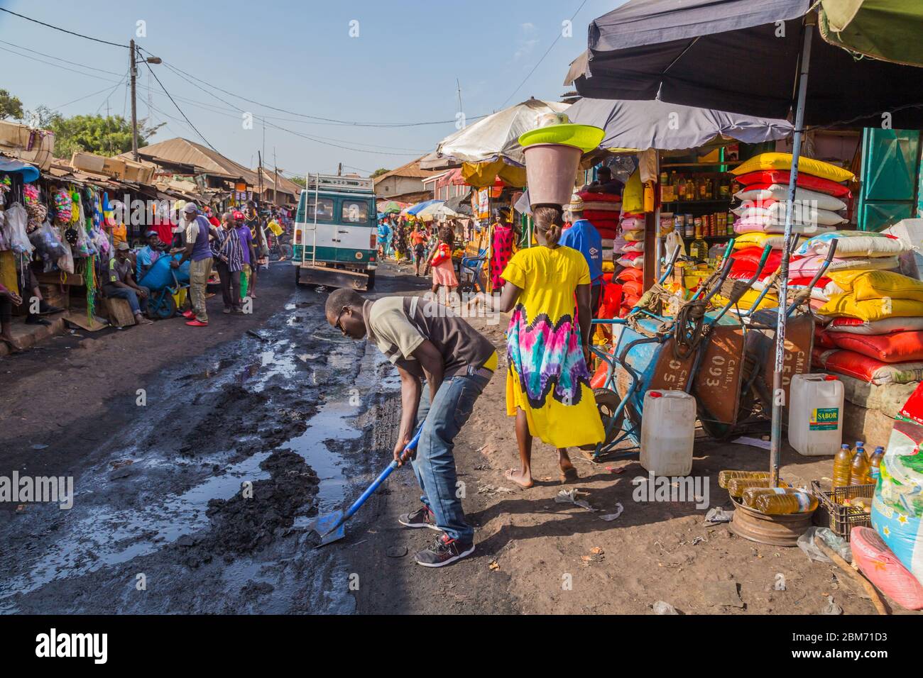 Bissau, Republic of Guinea-Bissau - January 6, 2020: Street scene in the city of Bissau with people at the street market, Guinea Bissau Stock Photo
