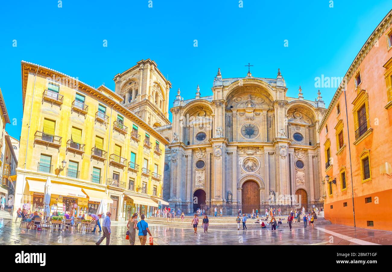 GRANADA, SPAIN - SEPTEMBER 25, 2019: Panorama of the facade of Cathedral, shaped as Triumphal arch and decorated with stone columns, sculptures and ga Stock Photo
