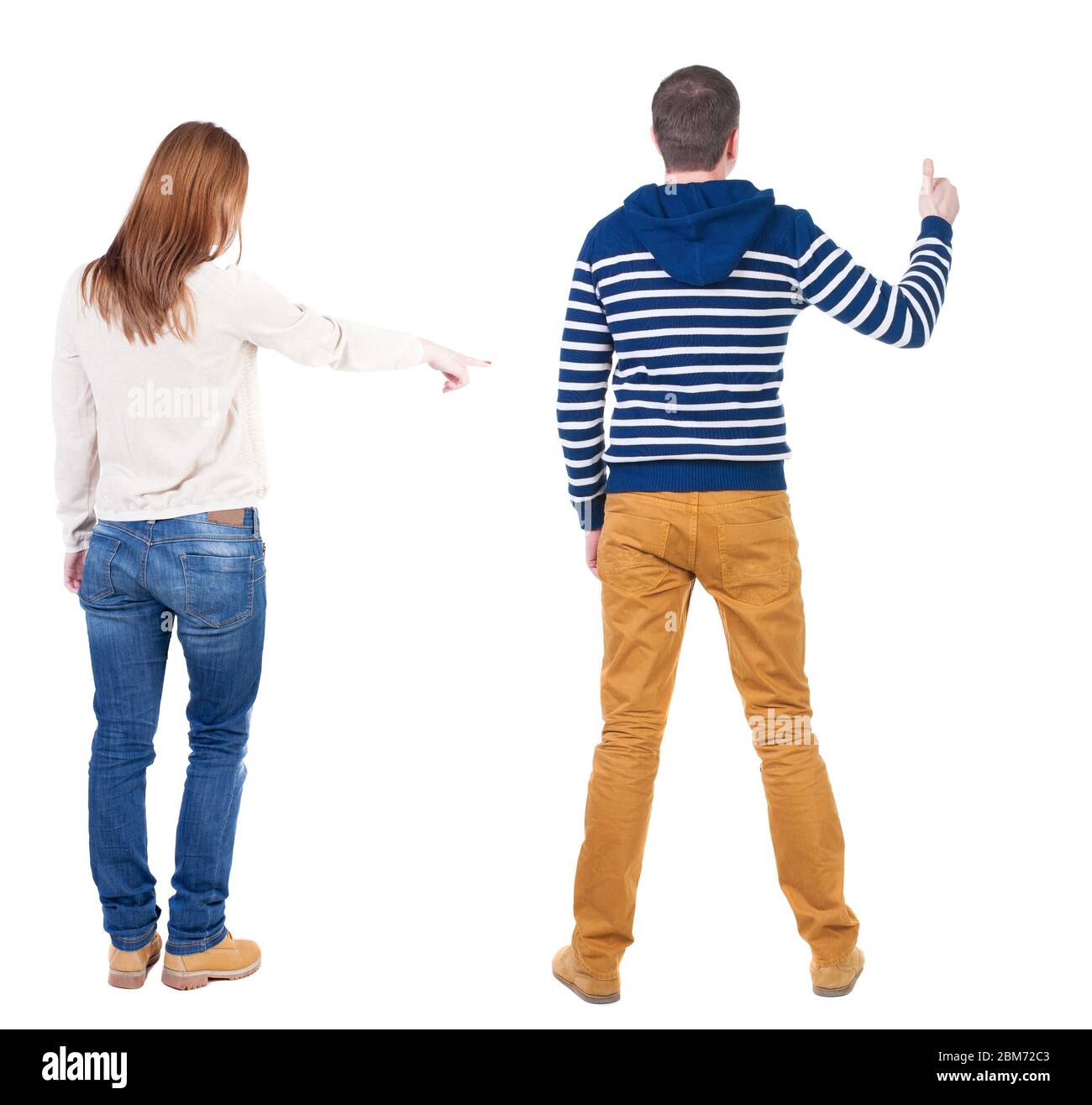 Back view of couple in sweater pointing. Rear view people collection ...