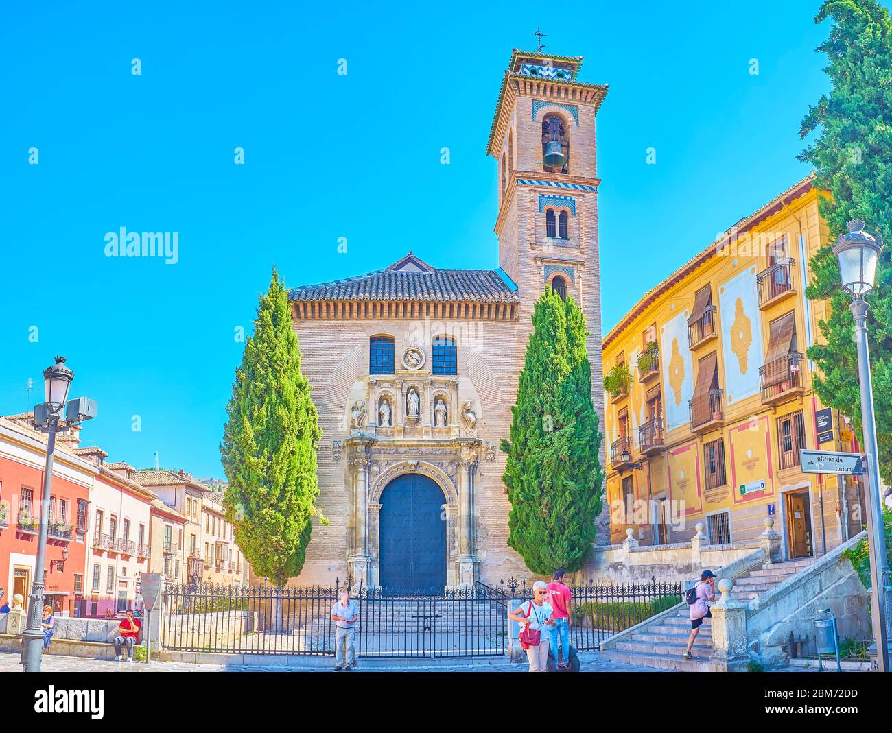 GRANADA, SPAIN - SEPTEMBER 25, 2019: The facade of medieval San Gil and Santa Ana church is decorated with carved stone sculptures, relief patterns an Stock Photo
