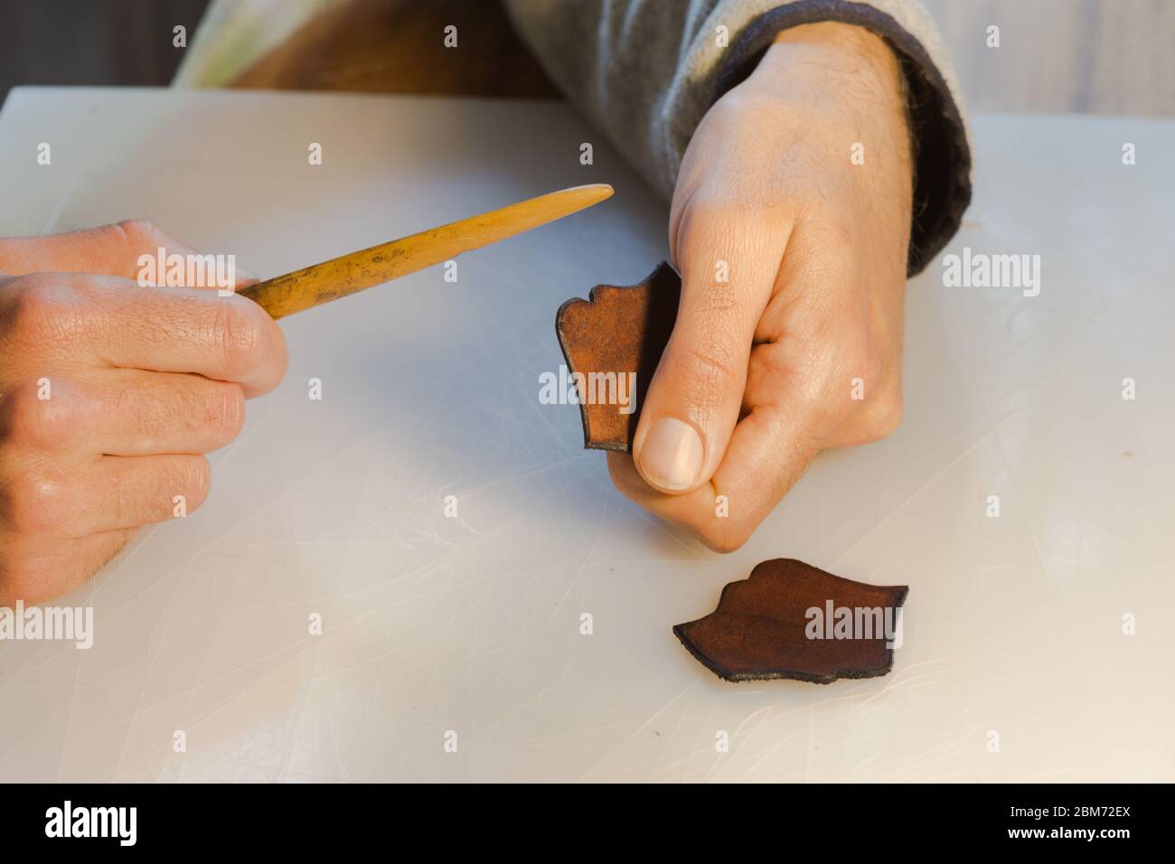 Leather edge burnishing, leather edge finishing by handmade tools. The