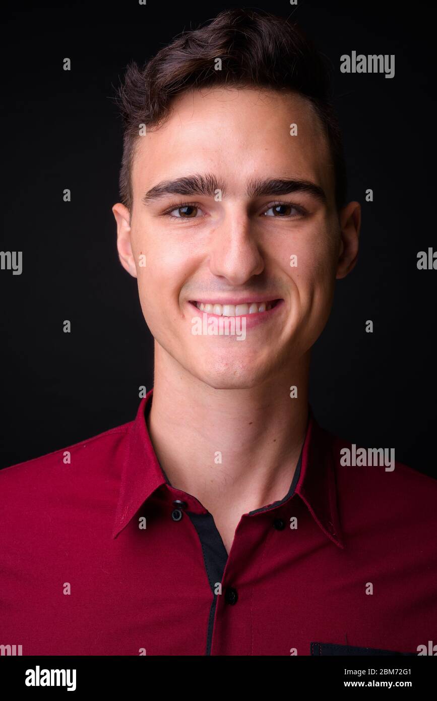 Portrait of happy young handsome businessman smiling Stock Photo - Alamy