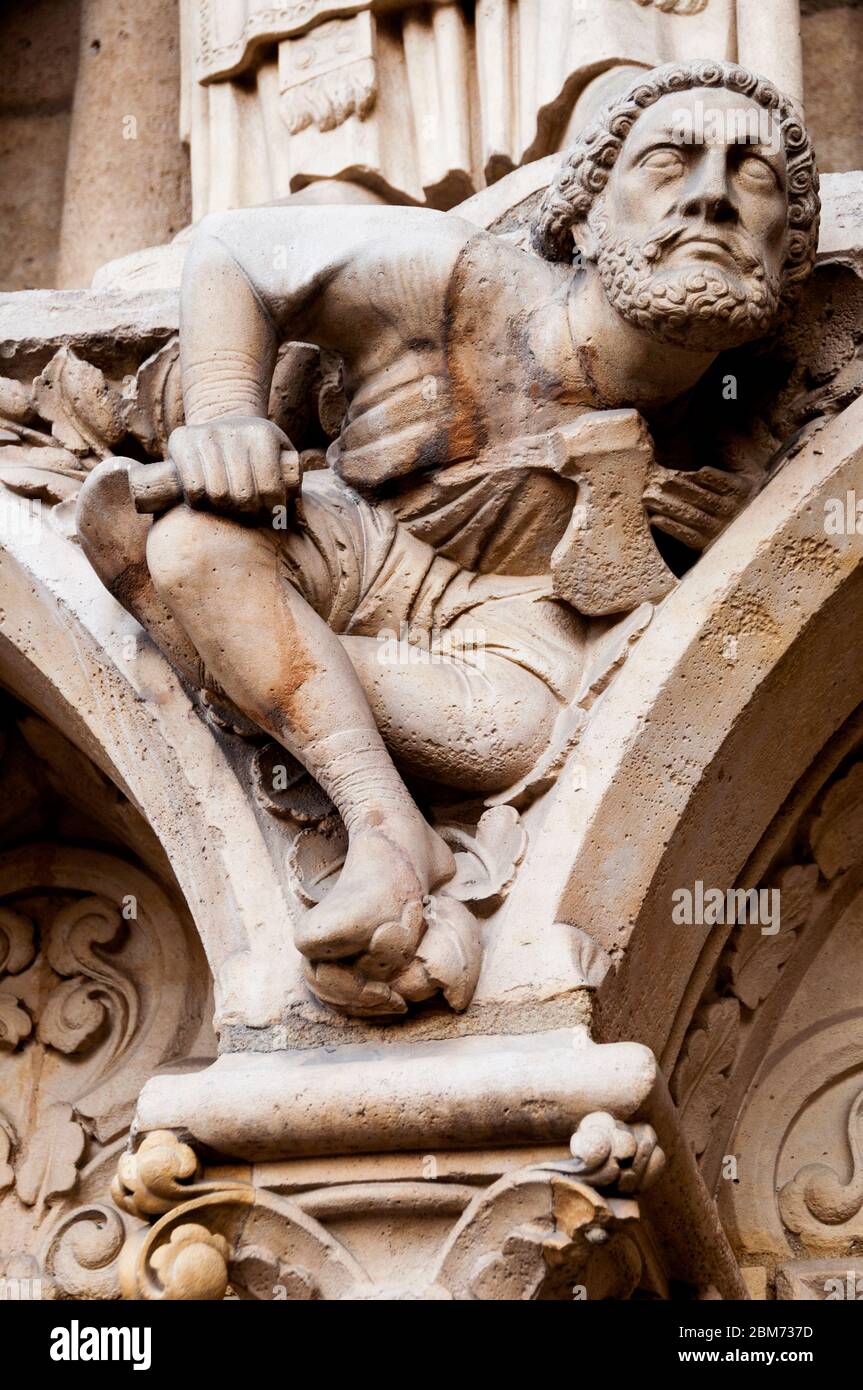 Captured on the facade of Notre Dame Cathedral in Paris, a stone mason and  his tools defy resistance to emerge from the stone a vision of grandeur!  Stock Photo - Alamy