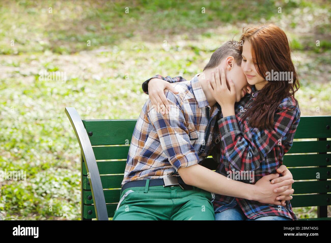 Teenage couple hugging in park hi-res stock photography and images - Alamy