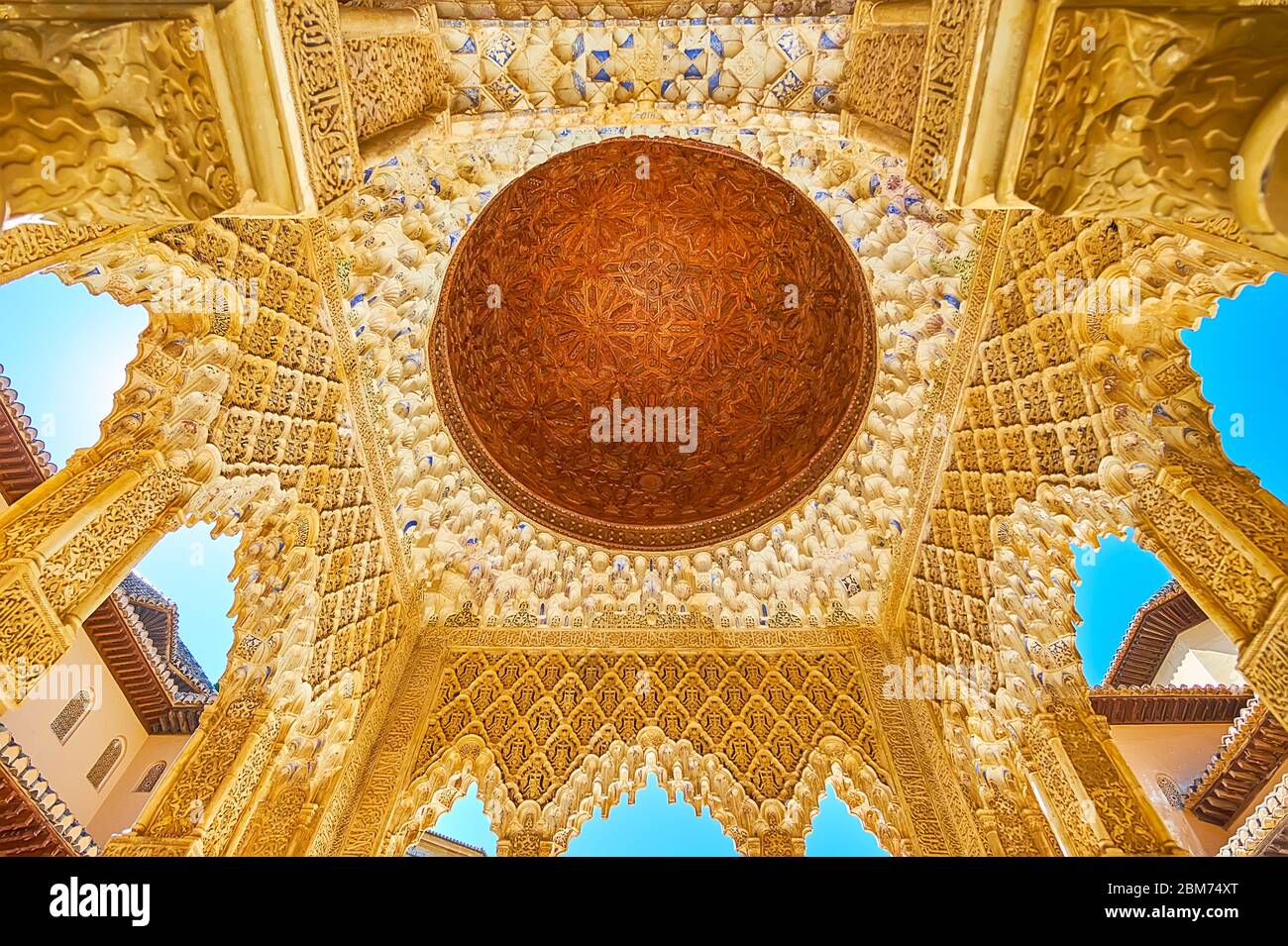 GRANADA, SPAIN - SEPTEMBER 25, 2019: The masterpiece Mudejar decoration of portico dome in Palace of Lions (Nasrid Palace, Alhambra) with carved woode Stock Photo