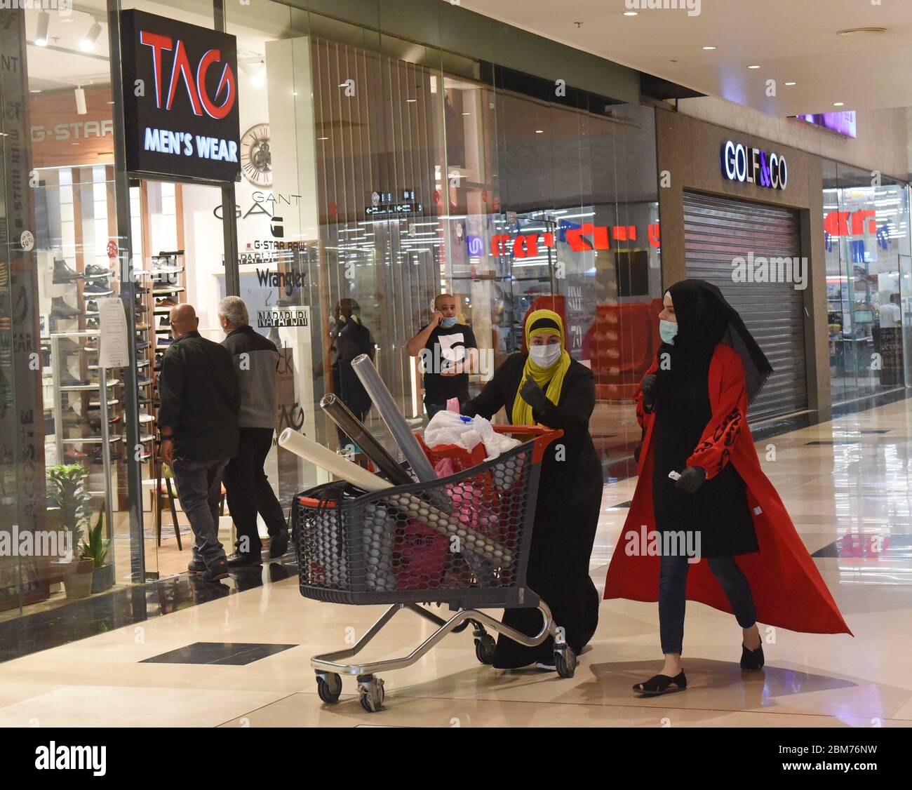 Atarot, Israel. 07th May, 2020. Palestinian shoppers wear masks, as a  precaution against COVID-19, while shopping in the Rami Levy Atarot Mall,  north of Jerusalem, on Thursday, May 7, 2020. Israel opened