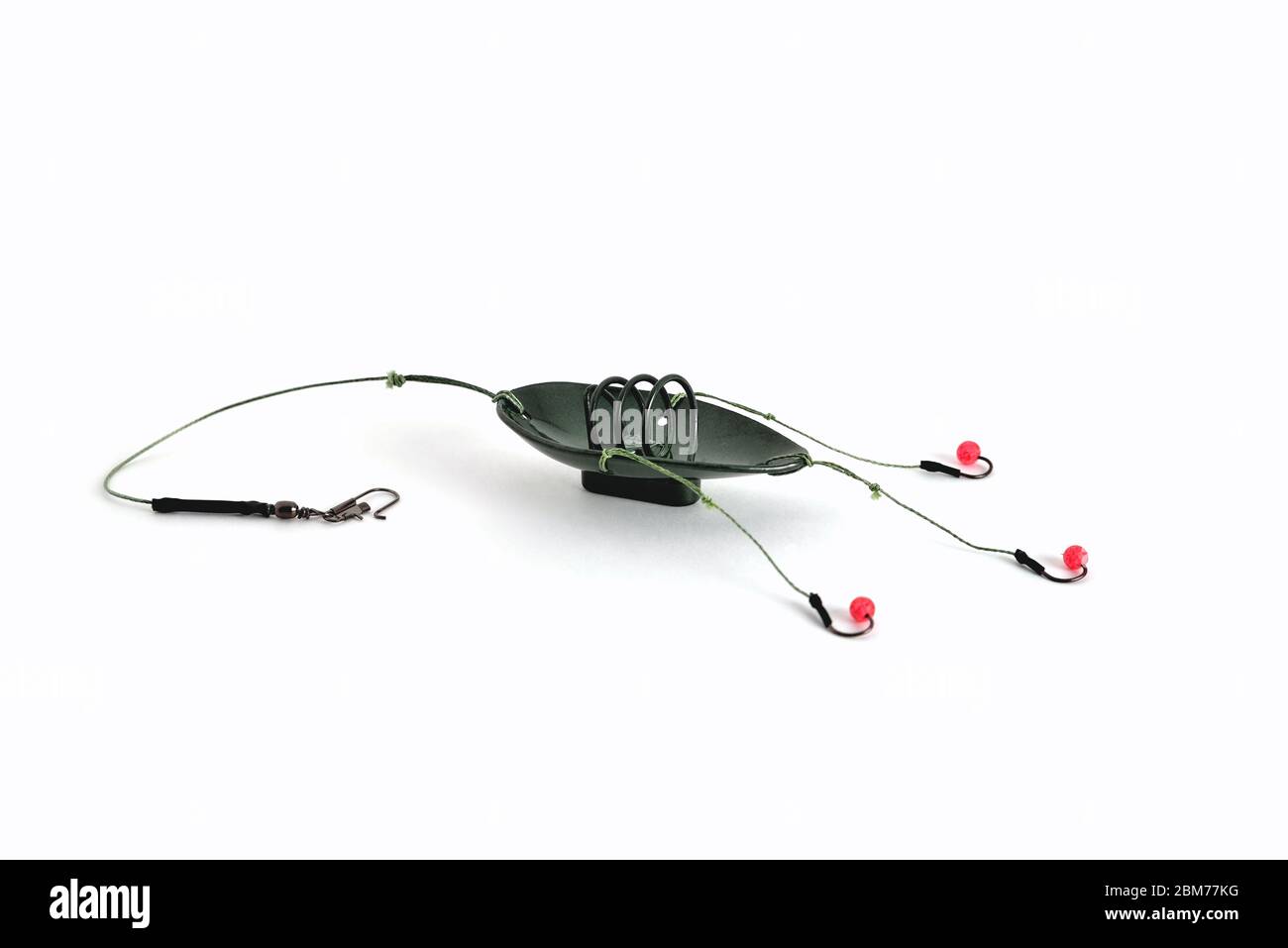 Fishing feeder and reel with accessories on white background Stock