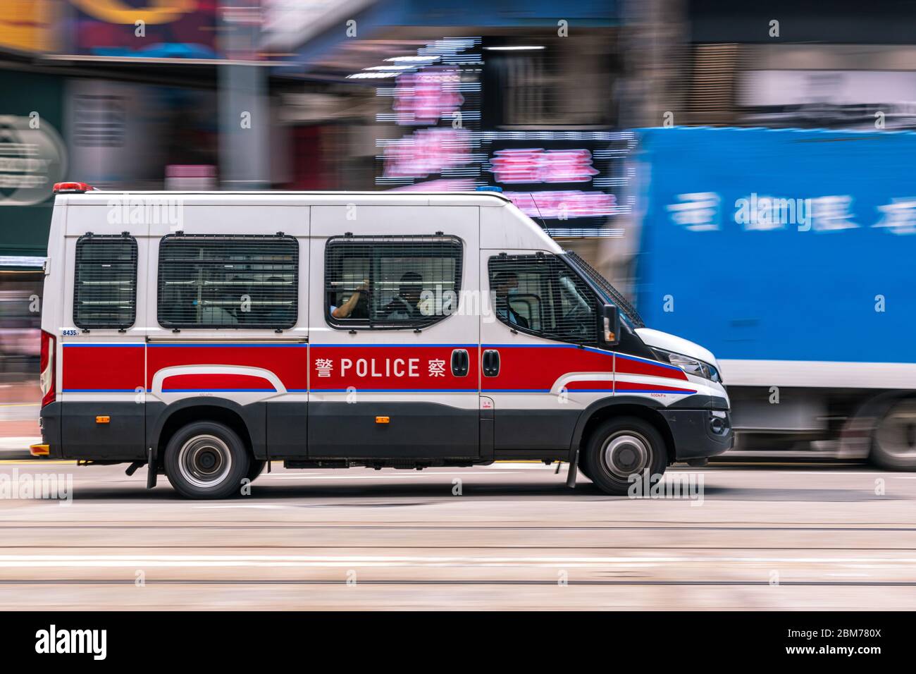 Casueway Bay, Hong Kong  - May 01, 2020 : Police car travel at business district of Hong Kong Stock Photo