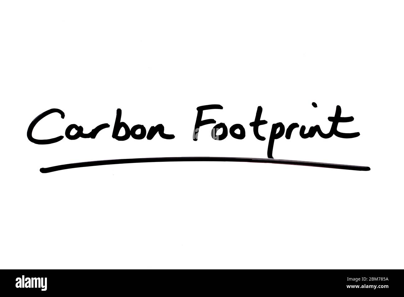 Carbon Footprint handwritten on a white background. Stock Photo